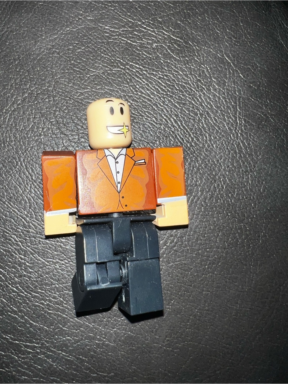 Block Figure Toy with Orange Jacket and Navy Legs Roblox